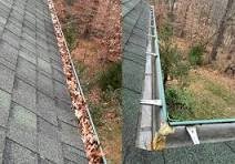Blocked gutter and stained fascia on semi-detached house in Stockport cleared by ground-level vacuum